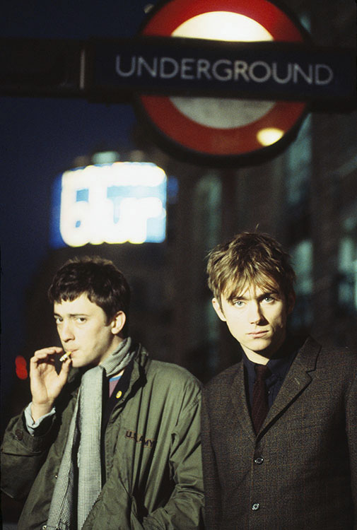 Kevin Cummins, 'Graham Coxon and Damon Albarn, Piccadilly Circus Underground station, London, February 1994'